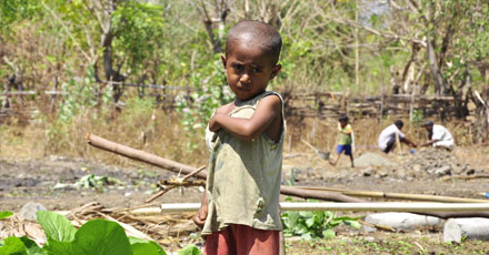 Girl surrounded by litter