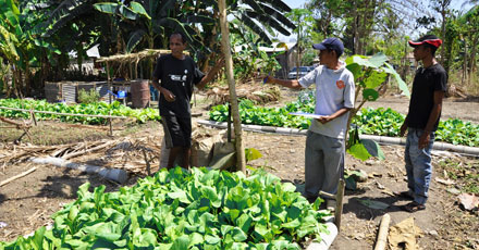 HIAM Health staff help a father establish.